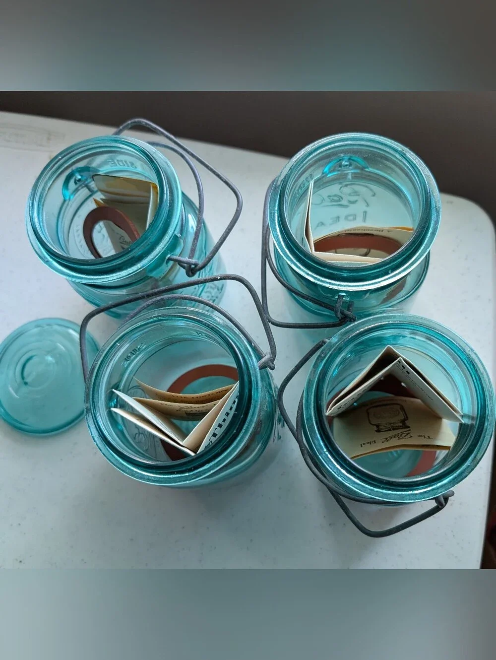 Set Of 4 Blue Ball Ideal Glass Mason Jars with Wire Bail Lids Farmhouse Decor